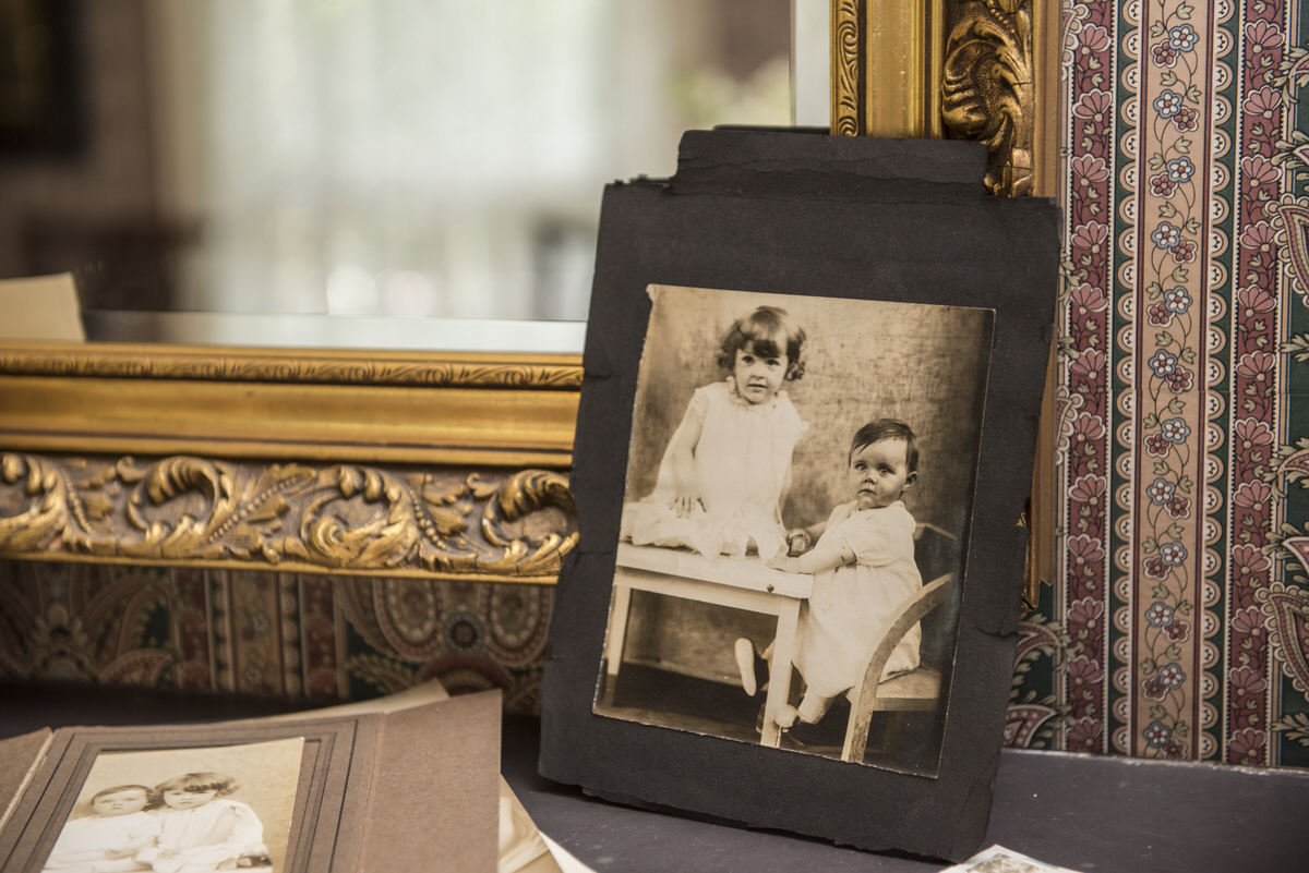 A vintage photo in a frame on a desk showing why family photos are important