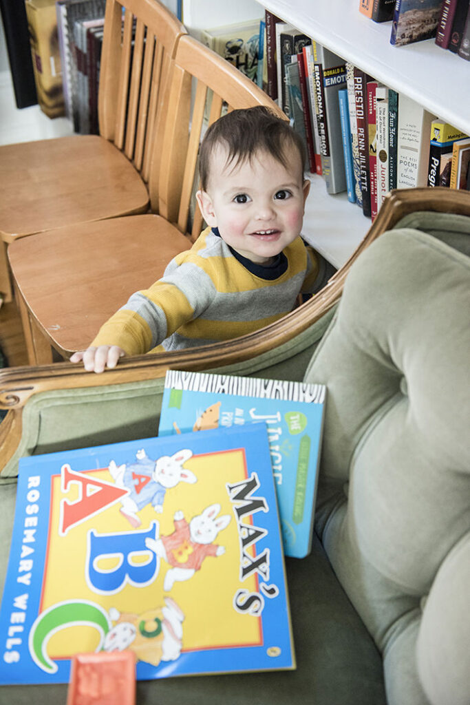 A small child looking up and smiling 